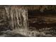 Scenic waterfall feature cascading into the creek, adding a natural touch at 6290 Cascade Palmetto Hwy, Fairburn, GA 30213