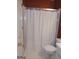 Bathroom featuring a toilet and tub/shower combination with white tile flooring at 920 Courthouse Rd, Temple, GA 30179