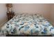 Bedroom featuring a bed with white comforter and blue and orange floral design at 920 Courthouse Rd, Temple, GA 30179