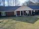Charming one-story brick home with a welcoming front porch and well-maintained lawn at 920 Courthouse Rd, Temple, GA 30179
