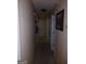Hallway with beige walls and carpet flooring with doors leading to other rooms at 920 Courthouse Rd, Temple, GA 30179