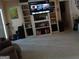 Spacious living room with built-in shelves and a large screen TV at 920 Courthouse Rd, Temple, GA 30179