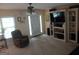 Cozy living room featuring comfortable seating, built-in shelving, and a bright, inviting ambiance at 920 Courthouse Rd, Temple, GA 30179