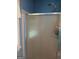 Bathroom shower stall with glass doors in a neutrally-painted bathroom at 920 Courthouse Rd, Temple, GA 30179