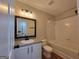 This bathroom has a bath/shower combo, single sink vanity, and neutral paint at 2268 Nicole Dr, Hampton, GA 30228