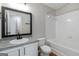 Bathroom featuring a white vanity, mirror, and a shower-tub combination at 2268 Nicole Dr, Hampton, GA 30228