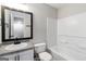 Bathroom featuring a white vanity, mirror, and a shower-tub combination at 2268 Nicole Dr, Hampton, GA 30228