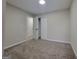 This bedroom has neutral paint and carpet and closet and bathroom access at 2268 Nicole Dr, Hampton, GA 30228
