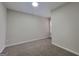 This bedroom has neutral paint and carpet and a modern recessed light fixture at 2268 Nicole Dr, Hampton, GA 30228