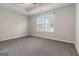 A neutral bedroom featuring a window with exterior views at 2268 Nicole Dr, Hampton, GA 30228