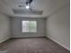 This bedroom has neutral paint, carpet, and a modern ceiling fan at 2268 Nicole Dr, Hampton, GA 30228