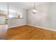 Open-concept dining area with modern lighting and hardwood floors, perfect for entertaining guests at 2268 Nicole Dr, Hampton, GA 30228