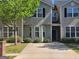 Inviting townhome featuring a well-manicured lawn and charming curb appeal, perfect for comfortable living at 2268 Nicole Dr, Hampton, GA 30228