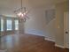 Bright living room with wood-look floors and large windows for ample natural light at 2268 Nicole Dr, Hampton, GA 30228