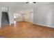 Well-lit living room featuring hardwood floors, staircase, and an open view into the adjacent kitchen at 2268 Nicole Dr, Hampton, GA 30228