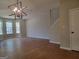 Bright living room with wood-look floors and large windows for ample natural light at 2268 Nicole Dr, Hampton, GA 30228