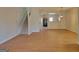Open-concept living area showcasing hardwood floors and seamless transition to dining and kitchen spaces at 2268 Nicole Dr, Hampton, GA 30228