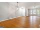 Bright and airy living area with hardwood floors, modern lighting, and a spacious layout at 2268 Nicole Dr, Hampton, GA 30228