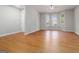 Comfortable living space with a ceiling fan, hardwood floors, and abundant natural light from the windows at 2268 Nicole Dr, Hampton, GA 30228