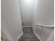 Carpeted stairway with white handrails, providing a safe and stylish transition between floors at 2268 Nicole Dr, Hampton, GA 30228