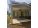 Covered back porch with outdoor fan at 1049 Homer Ln, Stockbridge, GA 30281