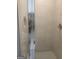 Modern tiled shower with glass door and chrome fixture at 1049 Homer Ln, Stockbridge, GA 30281