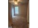 Bedroom featuring carpeted flooring, a ceiling fan, and a window for natural light at 1049 Homer Ln, Stockbridge, GA 30281