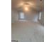 Spacious bonus room with carpet flooring, ample natural light, and a ceiling fan at 1049 Homer Ln, Stockbridge, GA 30281