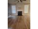 Living room featuring hardwood floors, a fireplace, and large windows for ample natural light at 1049 Homer Ln, Stockbridge, GA 30281