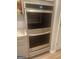 Modern stainless steel oven with built-in microwave in a neutral-toned kitchen at 1049 Homer Ln, Stockbridge, GA 30281