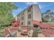 The backyard features a patio, fire pit, and mature trees at 165 Hidden Lake Dr, Fayetteville, GA 30215
