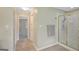 Bathroom showcases a glass-enclosed shower and towel rack with neutral wall paint and tile flooring at 165 Hidden Lake Dr, Fayetteville, GA 30215