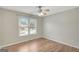 Bright bedroom featuring a ceiling fan and a window providing natural light and views of the neighborhood at 165 Hidden Lake Dr, Fayetteville, GA 30215