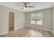This bedroom boasts wood floors, a ceiling fan, and a closet for maximum storage at 165 Hidden Lake Dr, Fayetteville, GA 30215