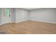 Unfurnished bedroom with hardwood floors and an entry door to the exterior at 165 Hidden Lake Dr, Fayetteville, GA 30215