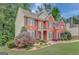 Attractive two-story brick home with side yard and well-maintained landscaping at 165 Hidden Lake Dr, Fayetteville, GA 30215