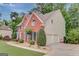 Two-story brick home with attached garage and lovely landscaped surroundings at 165 Hidden Lake Dr, Fayetteville, GA 30215