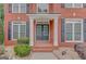Close-up of the home's front door, featuring white columns and black shutters at 165 Hidden Lake Dr, Fayetteville, GA 30215