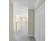 Upstairs hallway with carpet, wood railing, and white doors leading to various rooms at 165 Hidden Lake Dr, Fayetteville, GA 30215