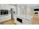 Gourmet kitchen with stainless appliances, a large island, granite counters, and modern finishes at 165 Hidden Lake Dr, Fayetteville, GA 30215