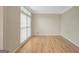 Bright, spacious living room featuring hardwood floors and large window at 165 Hidden Lake Dr, Fayetteville, GA 30215