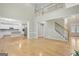 Bright open living room with hardwood floors, staircase, and an open concept design at 165 Hidden Lake Dr, Fayetteville, GA 30215
