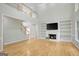 Spacious living room features a fireplace, custom built-ins, and a soaring two-story ceiling at 165 Hidden Lake Dr, Fayetteville, GA 30215