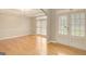 Open-concept living area with hardwood floors and ample natural light at 165 Hidden Lake Dr, Fayetteville, GA 30215