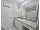 Bright bathroom featuring a granite countertop vanity with a tub and shower combination at 3075 Lakeside Cir, Covington, GA 30016