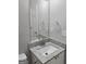Bathroom featuring a granite countertop vanity with a sink and a large mirror at 3075 Lakeside Cir, Covington, GA 30016