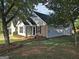 Charming home with beautiful landscaping and a well-maintained lawn providing great curb appeal at 3075 Lakeside Cir, Covington, GA 30016