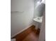 Pedestal sink bathroom with hardwood floors at 921 Winding Down Way, Grayson, GA 30017