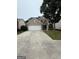 Charming two-story brick home with a two-car garage and mature landscaping at 921 Winding Down Way, Grayson, GA 30017