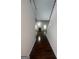 A hallway with wood floors, a staircase and white railings and trim at 921 Winding Down Way, Grayson, GA 30017